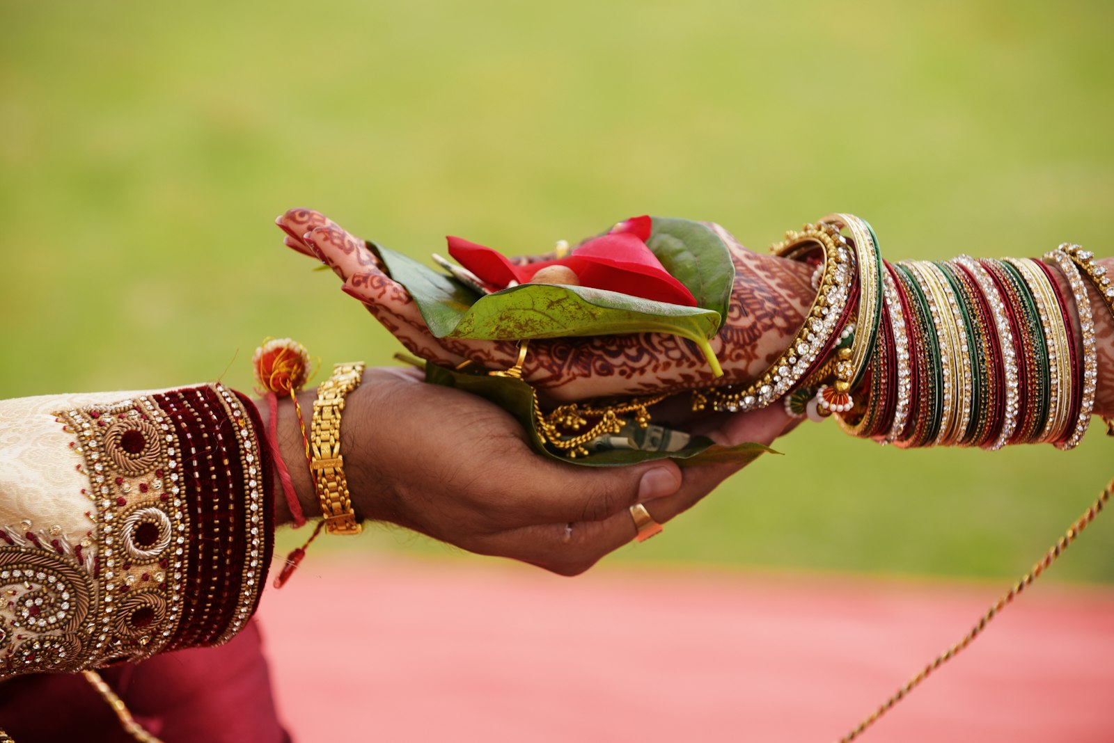 Hands exchanging a traditional gift